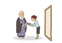 六、拝仏終了。お守りを受け取る。